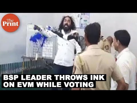 BSP leader, Sunil Khambe threw ink on EVM while voting at a polling booth in Maharashtra