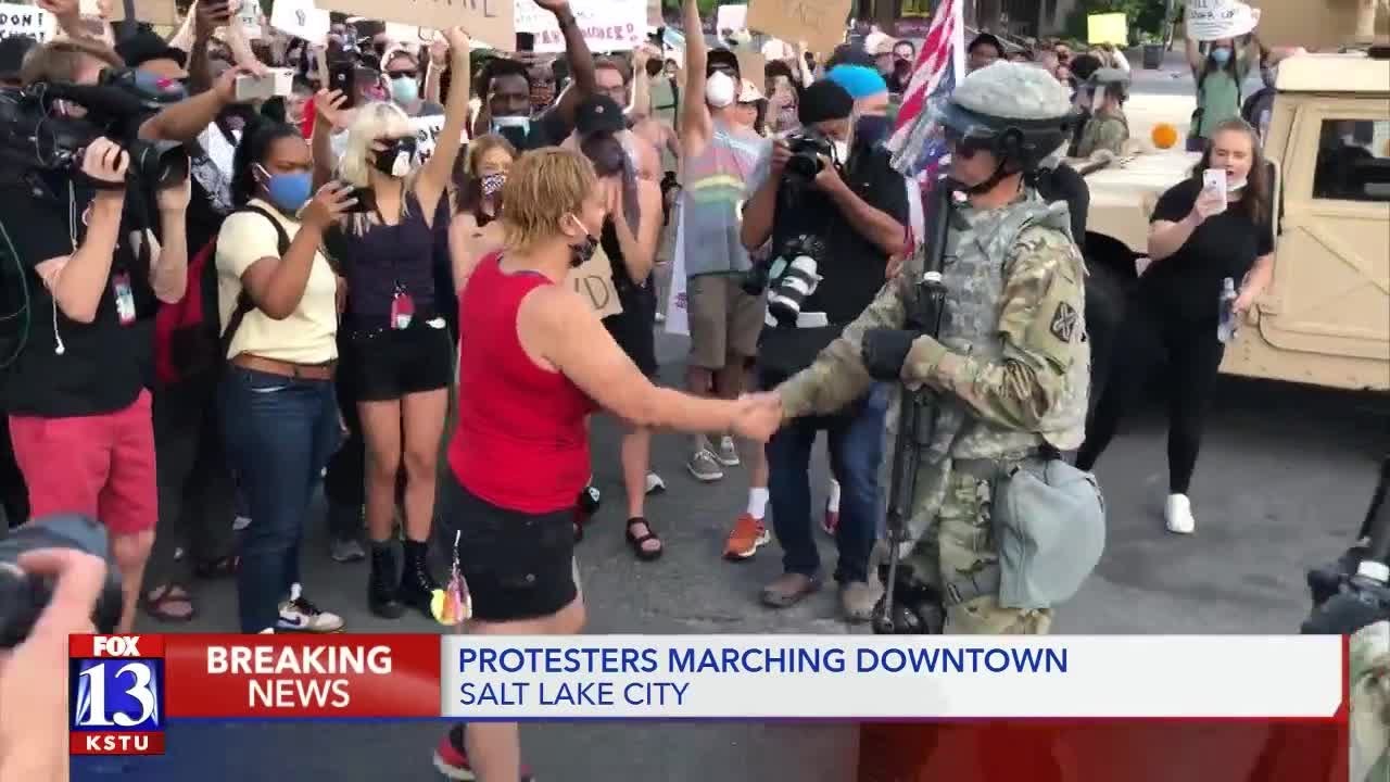 SLCPD, Natl. Guardsmen shake hands with protesters