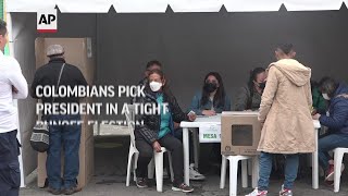 Colombians pick president in a tight runoff election