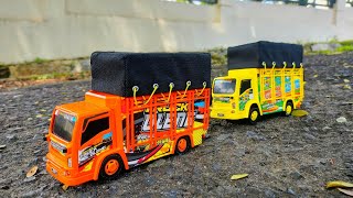 Wobbly Truck Toy, Cement Mixer, Telolet Bus, Ambulance, Police Car, Anomaly, Excavator, Truck.