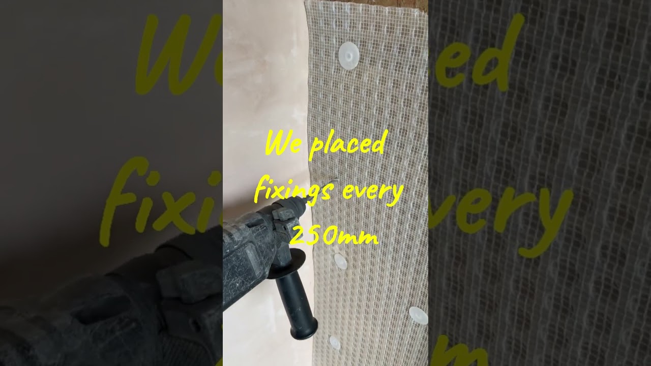 Tanking a wall with a plastic membrane to stop damp penetrating into the plasterboard.