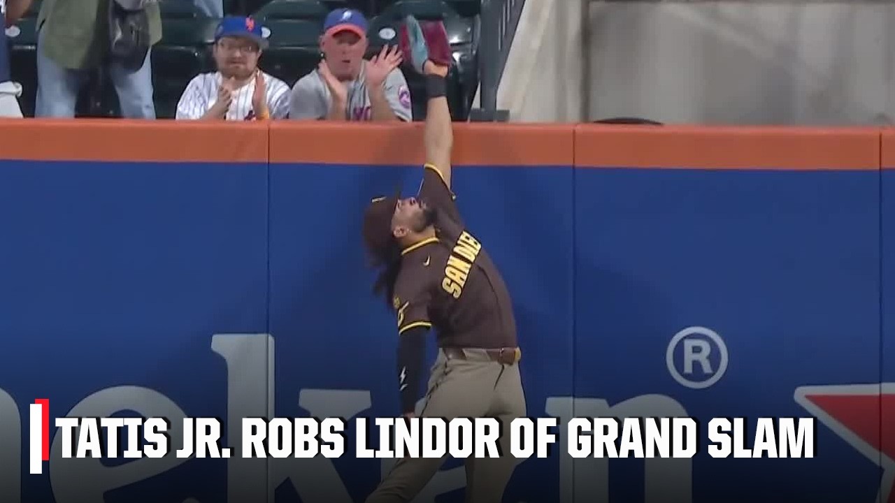 Fernando Tatis Jr. leaps OVER THE WALL to rob Francisco Lindor | ESPN MLB