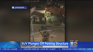 Driver Survives After SUV Flies Off 3rd Story Of Parking Garage, Lands Upside Down