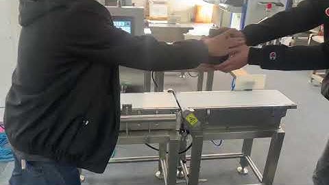 checkweigher for cans with pusher rejection system