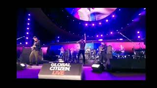 Coldplay performing My Universe with BTS on screen at Global Citizen Live