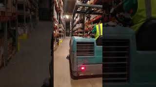 Commercial cleaning: Tennant s20 sweeper cleaning warehouse floor.