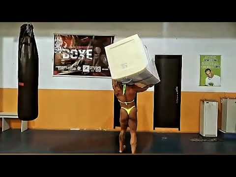 WOMAN LIFTS A FRIDGE