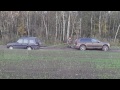 Volkswagen Touareg 3.0 TDI pulling Land Rover Discovery out of mud