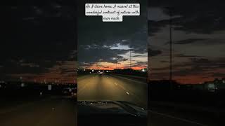 As I drive home, I gaze in awe at the amazing RED SUNSET,   casting a warm glow over the city lights