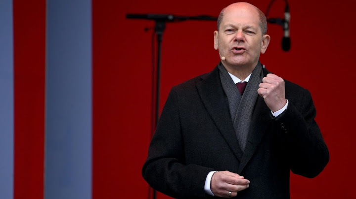 Scholz zu Gegendemonstranten: "Schreit ruhig" | AFP
