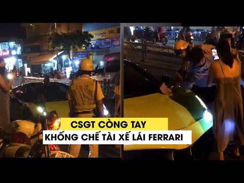 Xôn xao video tài xế lái siêu xe Ferrari bị CSGT còng tay khống chế ở Sài Gòn