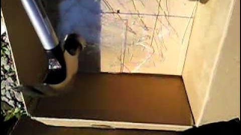 Breaking glass with hammer in slow motion