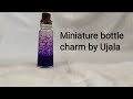 Miniature bottle charm by ujala,galaxy in a bottle.