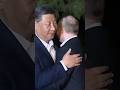 Putin and Xi Share Hug in Beijing