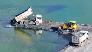 EP1402, Several SHACMAN transport rock filling in the lake using SHANTUI DH17 push rock in lake