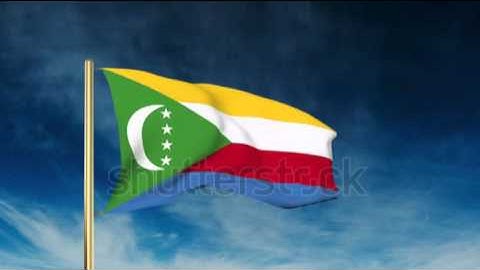 Comoros flag slider style. Waving in the wind with cloud background animation Stock video by