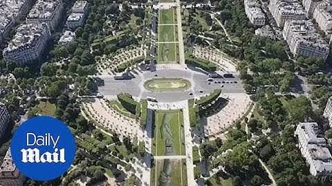 Stunning clasped hands artwork created at foot of Eiffel Tower