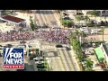 Pro-Cuban protestors flood Miami streets demanding Biden take action