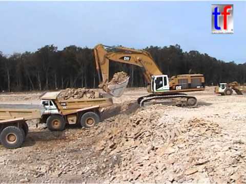 Caterpillar 385C Excavator Loading Trucks