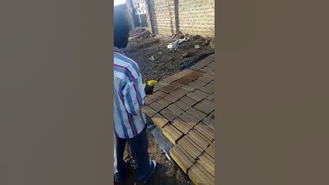 Kenya clay interlocking block machine customer curing soil mud bricks  #block #building