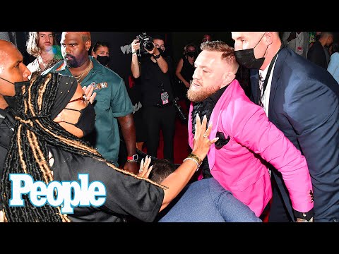 Conor McGregor Takes a Swing at Machine Gun Kelly During Altercation on VMAs Red Carpet | PEOPLE