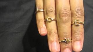 gold LOVE midi mid stackable ring set above knuckle ciara rihanna | celebrity jewelry