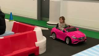 Sofia driving at Mercedes world