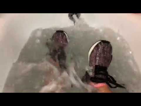 She is taking a bath in Adidas NMD