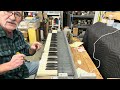 Adjusting key manuals to the proper tension. 