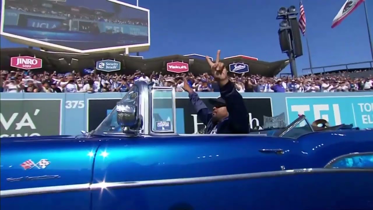 Ice Cube delivers World Series trophy to Dodgers at stadium rally after victory parade in muscle car