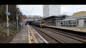 Heathrow Express class 387 head through Ealing Broadway.