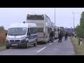 Migrants board buses headed for Hungary