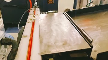 Auto Loader and belt conveyor feeder with Centerless Grinder Model Smith H150A.