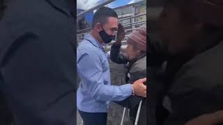 Disabled man gives his crutches to a disabled homeless amputee