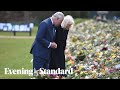 Charles and Camilla make emotional visit to floral tributes left in memory of Prince Philip