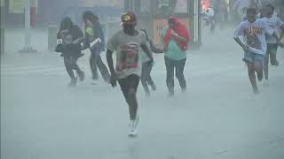 Rodeogoers run for cover as hail pelts them at NRG Park