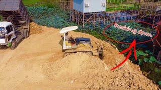 EP2\\ Amazing Project Filling Land by Bulldozers and Dump Truck Pushing Soil Into Mud.