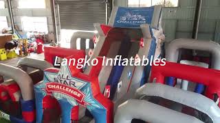 Blue and red inflatable obstacle course for outdoor party