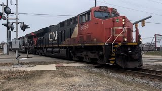 Nice long train in Kalamazoo, MI, with a nice suprise in the middle!