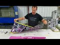 Bryan from Liquid Concepts rolling a gunstock in a pink camo