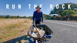 Running a half marathon with a rock and a wheelbarrow