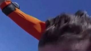 WORLD RECORD: Tattoo artist gives himself tattoo while skydiving