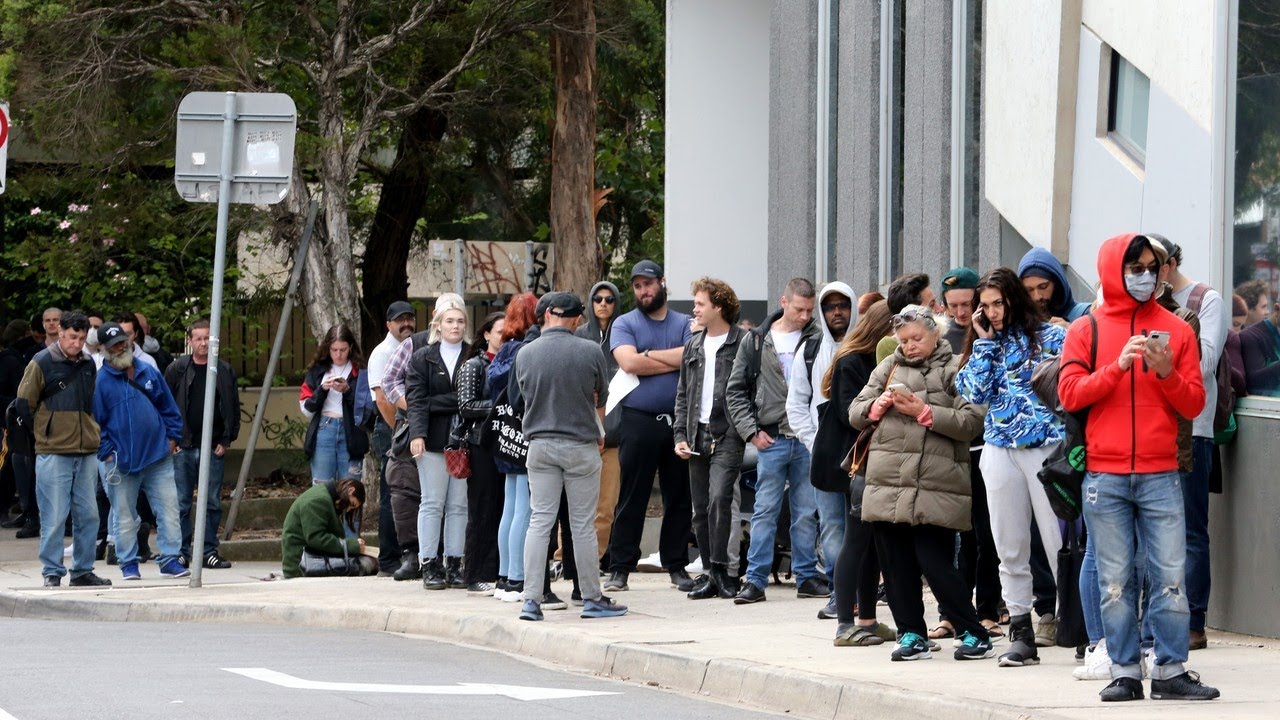 Government urges people to go home as massive lines form at Centrelink ...