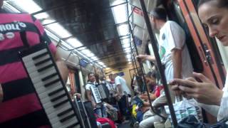 Street musicians in Madrid metro train