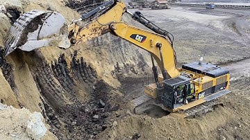 Caterpillar 385C Excavator Loading Overburden On Trucks At Busy Mining Site - Sotiriadis/Labrianidis