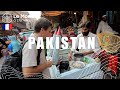 Dmitry komarov se promne dans un march pakistanais typique