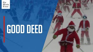 Hundreds of Santas hit ski slopes for charity in US
