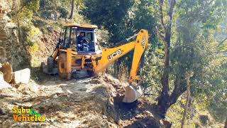 JCB Dojer working for making wide road in hilly area