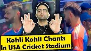 Virat Kohli acknowledges the crowd as they chant 'Kohli, Kohli', at a packed stadium in New York
