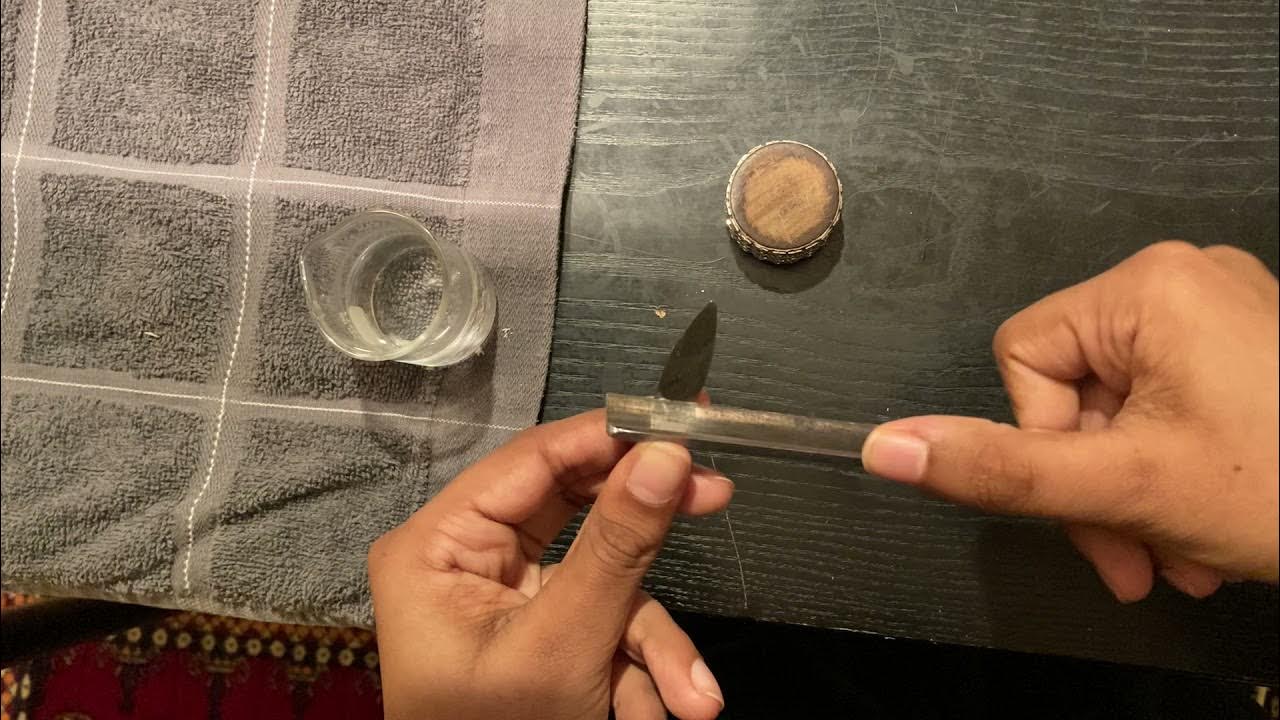 Refining the tip of the oboe reed Bhavani demonstrates scraping the tip for improved response